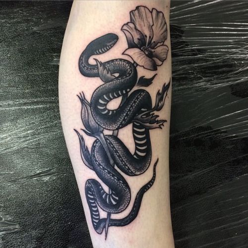 Black Ink Snake With Flowers Tattoo Design For Arm