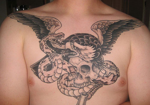 Black Ink Snake With Skull And Eagle Tattoo On Man Chest