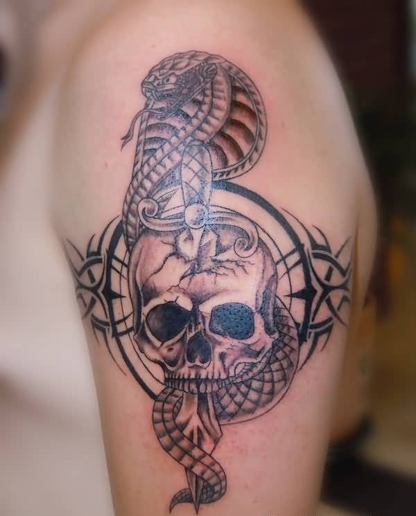 Black Ink Sword In Skull With Cobra Snake Tattoo On Left Shoulder