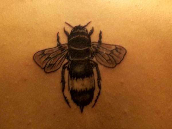 Black Ink Traditional Bumblebee Tattoo Design For Upper Back