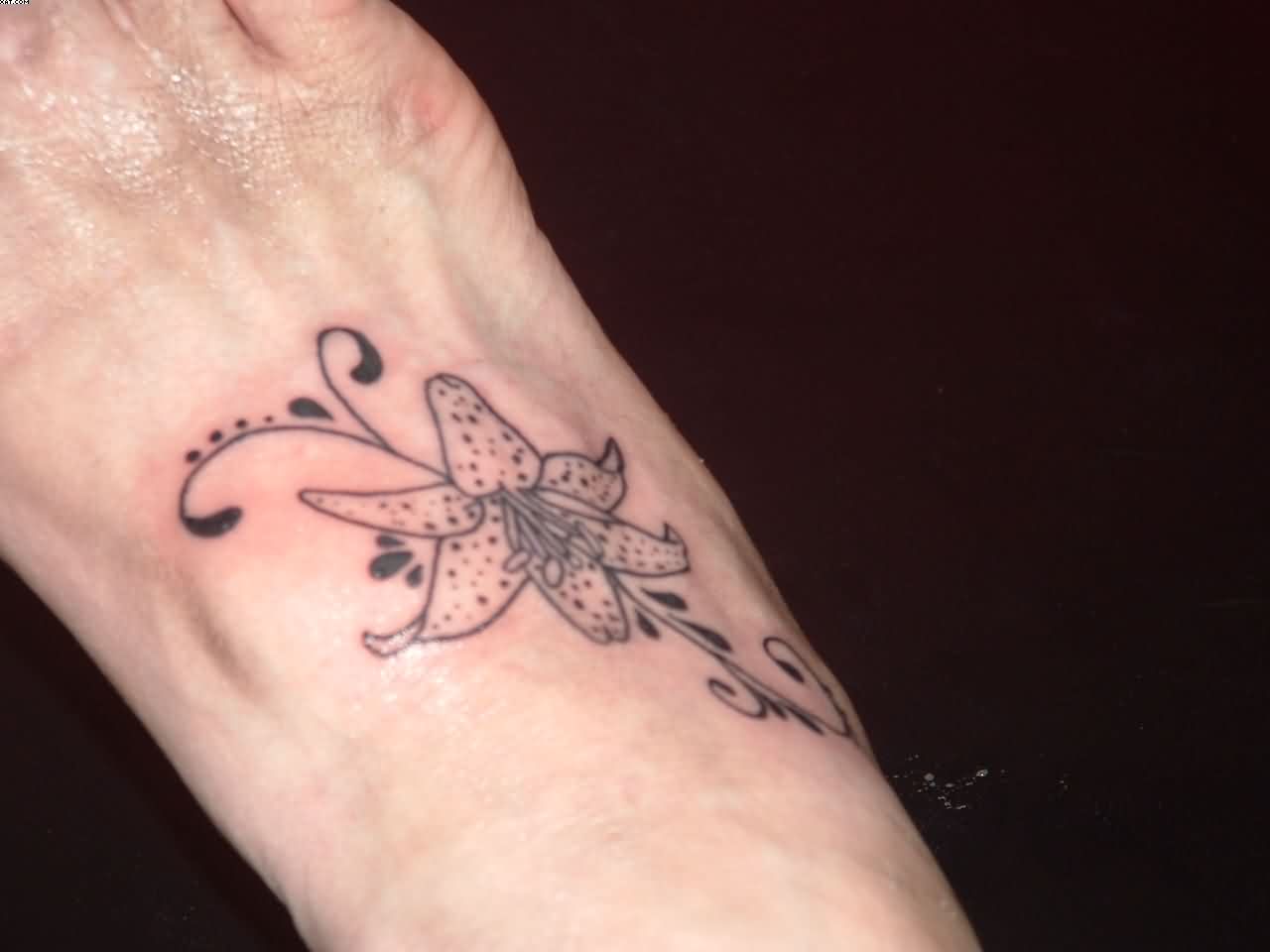 Black Lily Flower Tattoo On Right Foot
