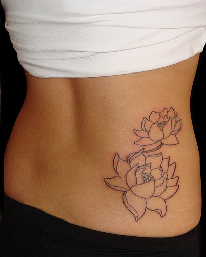 Black Outline Lotus Flowers Tattoo On Girl Right Hip