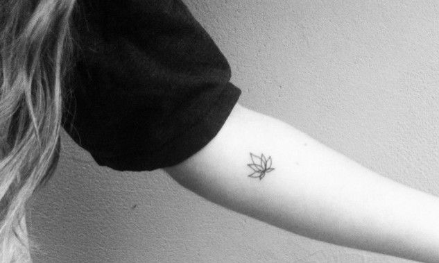 Black Outline Lotus Tattoo On Girl Left Forearm
