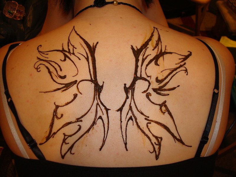 Black Outline Tribal Fairy Wings Tattoo On Women Upper Back