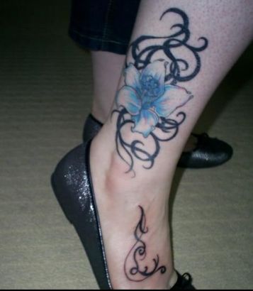 Black Tribal And Lily Tattoo On Ankle