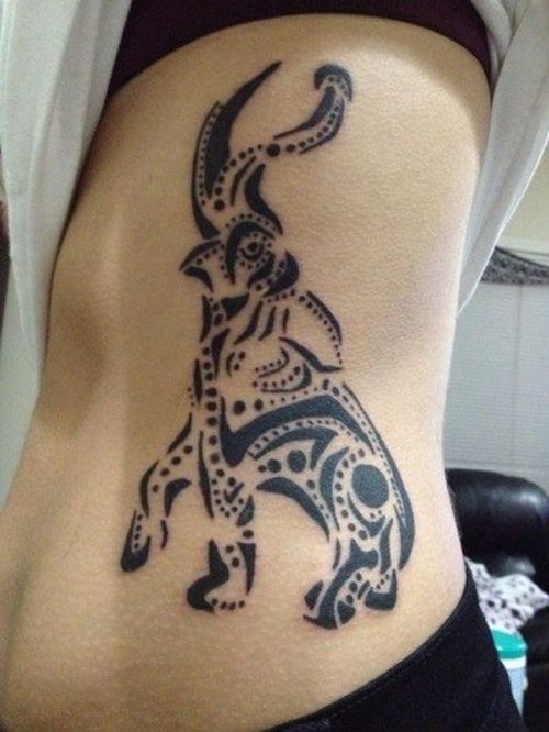 Black Tribal Elephant Trunk Up Tattoo On Girl Left Side Rib