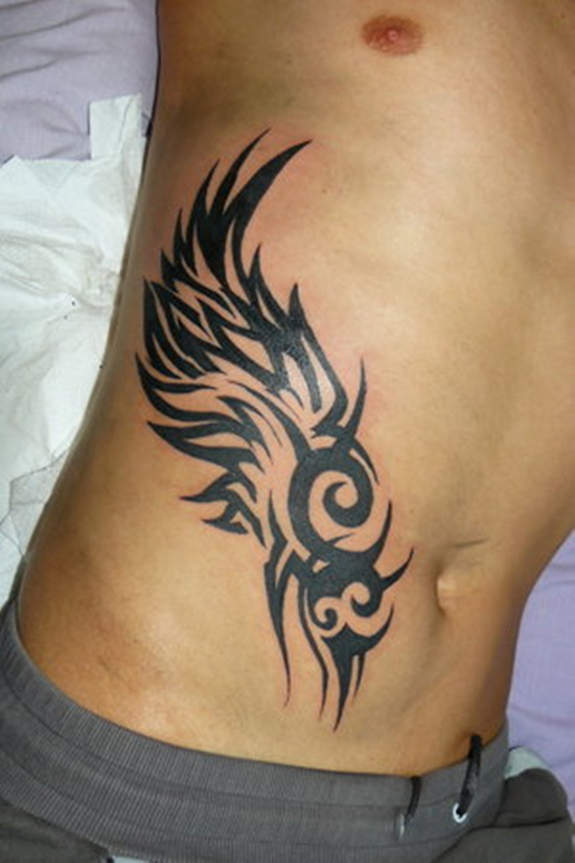 Black Tribal Fairy Wing Tattoo On Man Right Side Rib