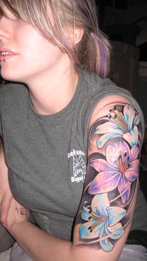Blue And Purple Lily Tattoos On Left Half Sleeve