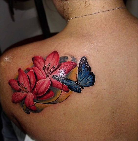 Blue Butterfly And Lily Flowers Tattoo On Left Back Shoulder