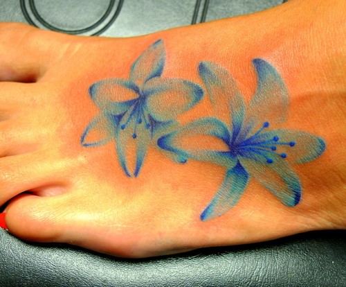 Blue Ink Lily Flowers Tattoo On Girl Left Foot