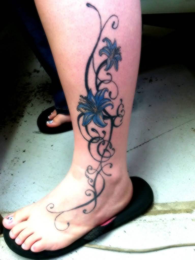 Blue Ink Lily Tattoo On Left Leg