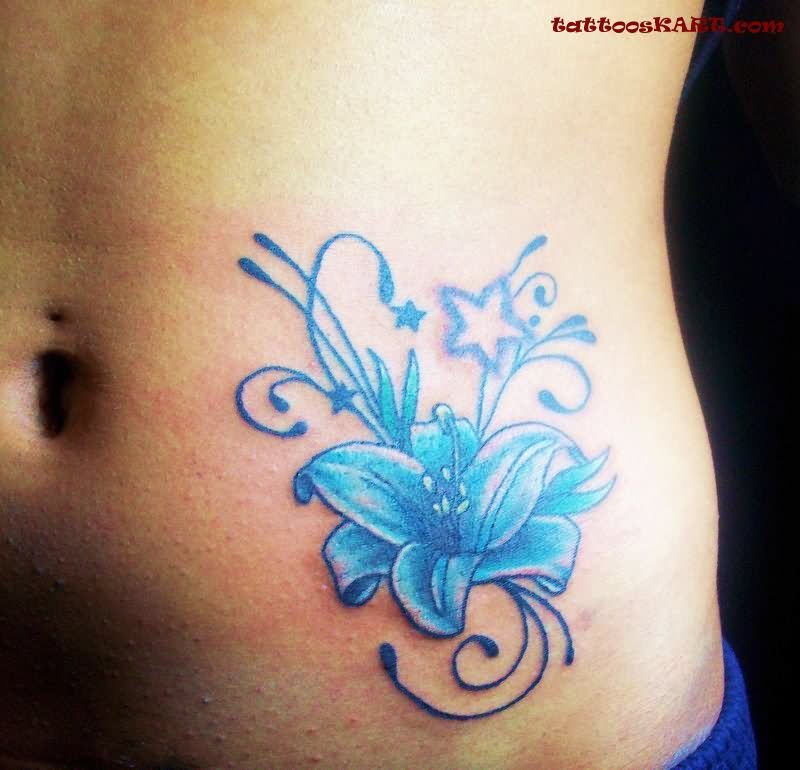 Blue Ink Lotus Flower Tattoo On Girl Left Hip