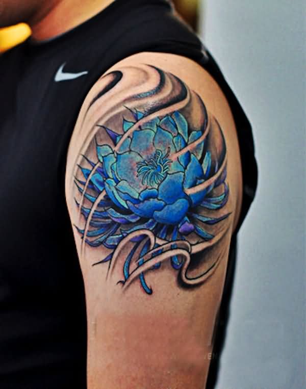 Blue Ink Lotus Flower Tattoo On Man Left Shoulder