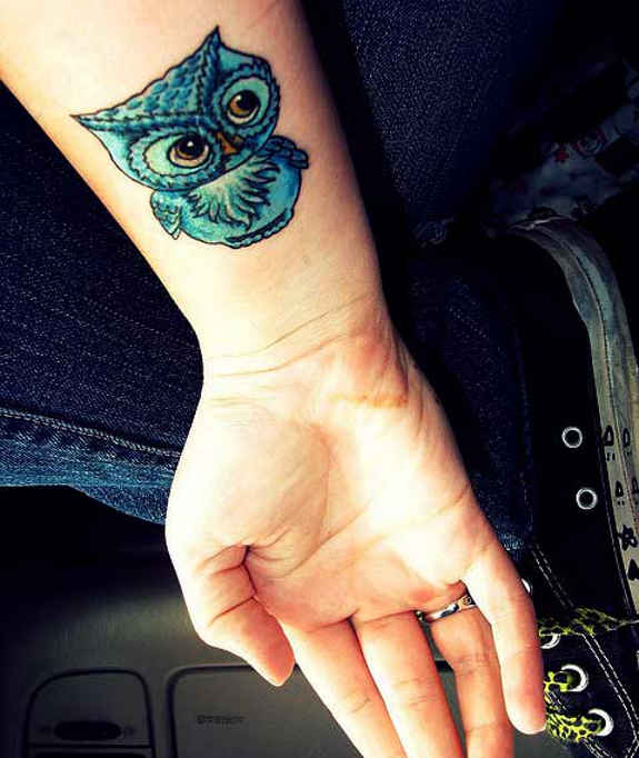 Blue Ink Owl Tattoo On Right Wrist