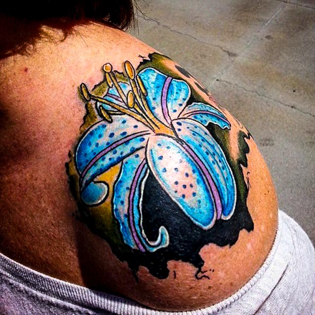 Blue Stargazer Lily Tattoo On Girl Left Shoulder