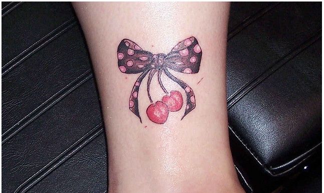 Bow And Cherry Tattoo On Side Leg