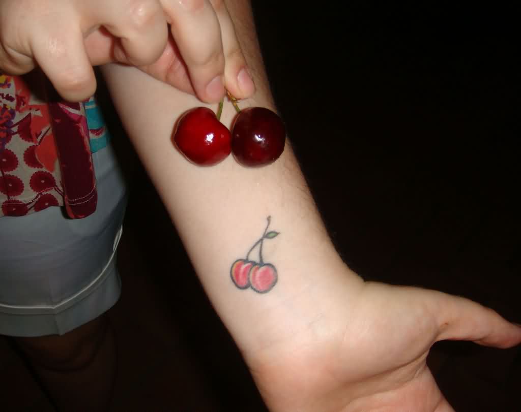 Cherry Tattoo On Left Wrist.
