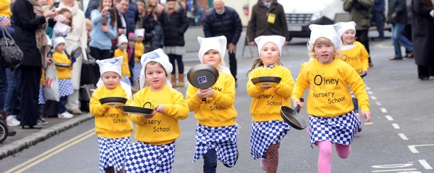 Children Running With Frying Pans In A Pancake Day Race