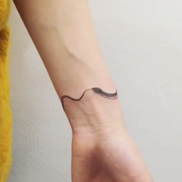 Classic Black Ink Snake Tattoo On Left Wrist