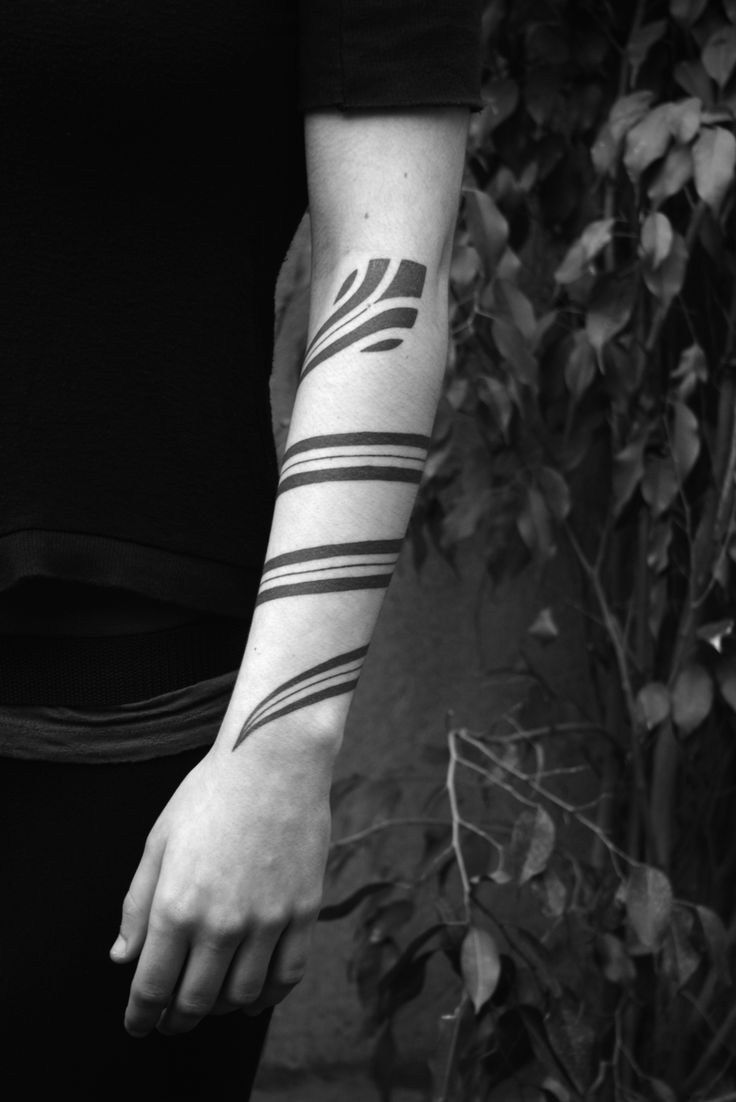 Classic Black Wrapped Around Arm Tattoo On Left Arm