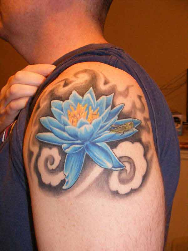 Classic Blue Ink Lotus Flower Tattoo On Man Left Shoulder
