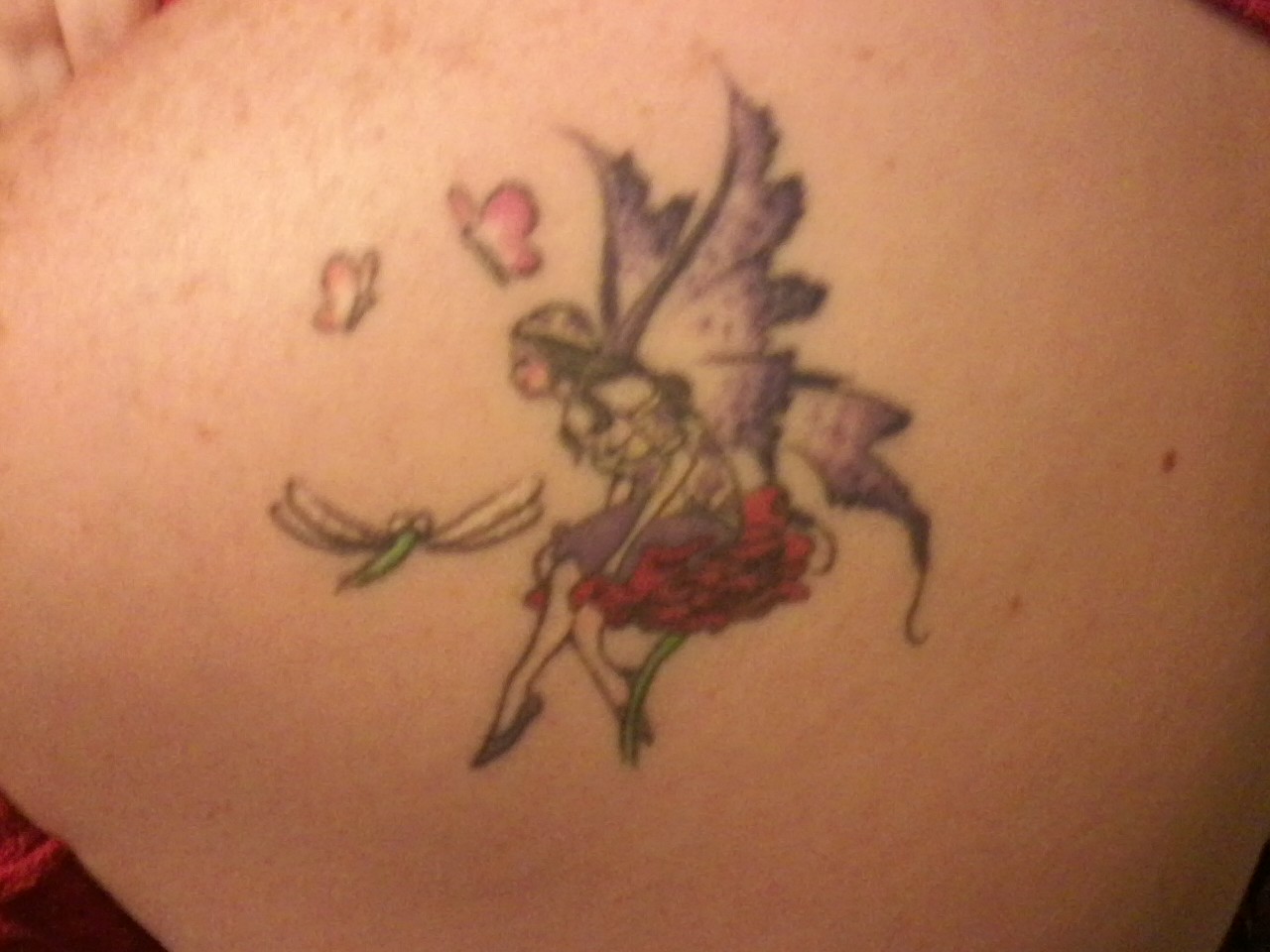 Classic Colorful Fairy On Flower With Flying Butterflies And Dragonfly Tattoo On Upper Back