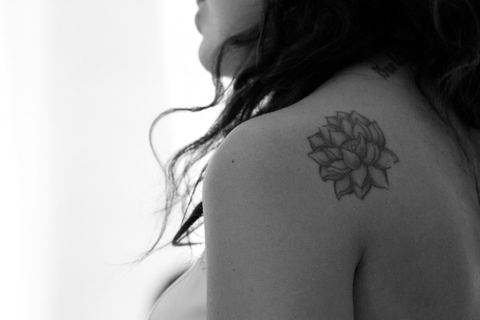 Classic Grey Ink Lotus Flower Tattoo On Girl Left Back Shoulder
