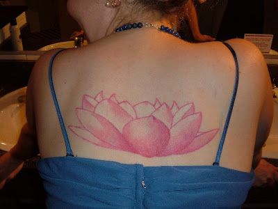 Classic Pink Ink Lotus Flower Tattoo On Female Upper Back