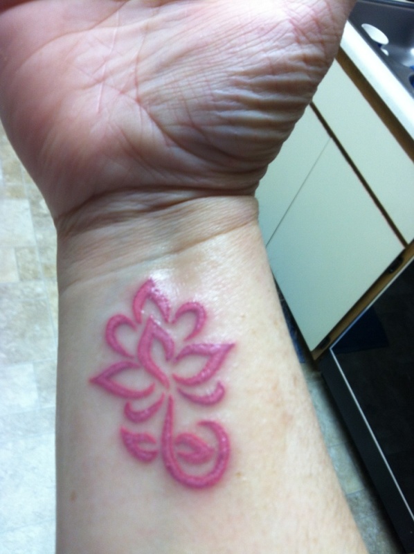 Classic Pink Ink Lotus Flower Tattoo On Right Wrist