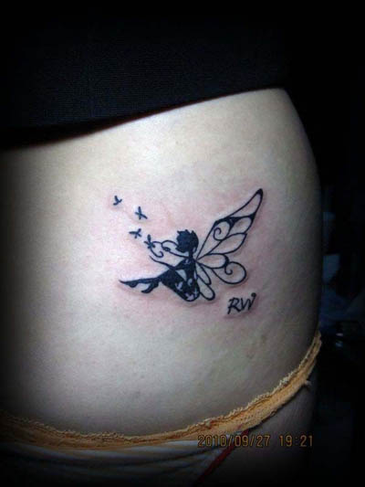 Classic Small Black Fairy With Flying Butterflies Tattoo Design For Lower Back