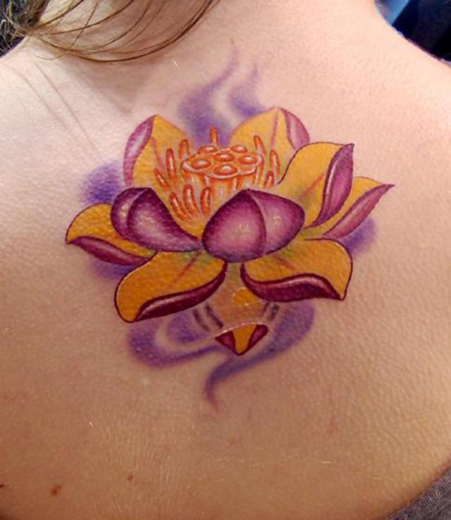 Classic Traditional Lotus Tattoo On Girl Upper Back By Carson Hill