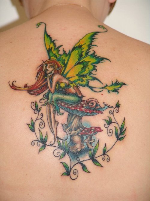 Colorful Fairy On Mushroom Tattoo On Man Upper Back