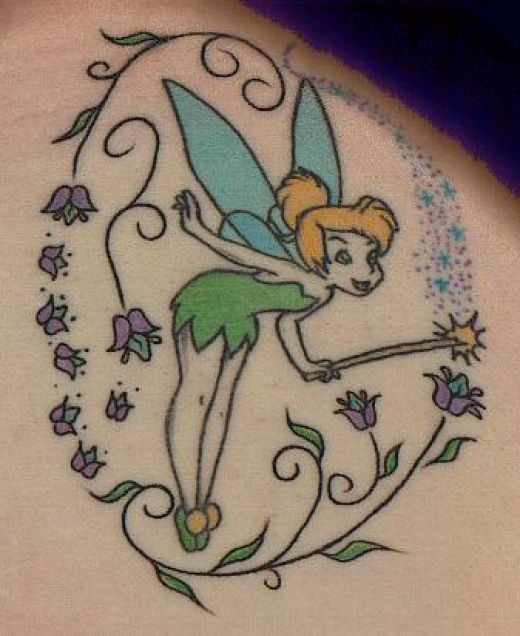 Colorful Fairy With Fairy Dust And Flowers Tattoo Design