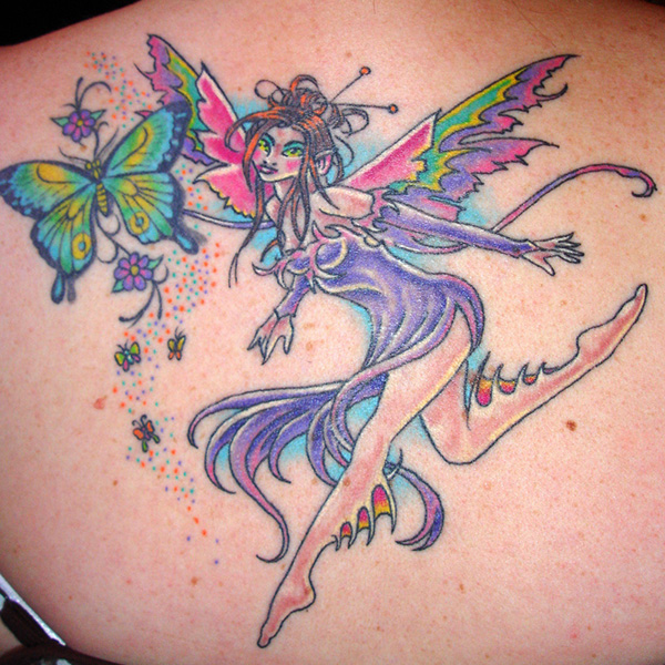 Colorful Fairy With Flowers And Flying Butterflies Tattoo On Left Back Shoulder
