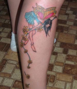 Colorful Fairy With Flowers Tattoo On Right Leg