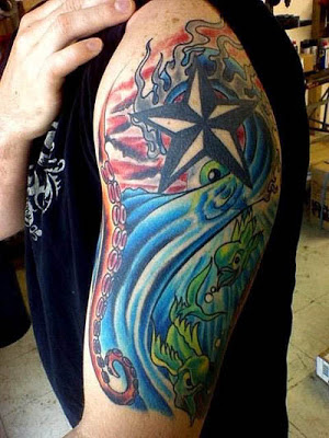 Colorful Flaming Nautical Star Tattoo On Left Half Sleeve