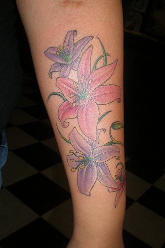 Colorful Lily Flowers Tattoo Design For Arm