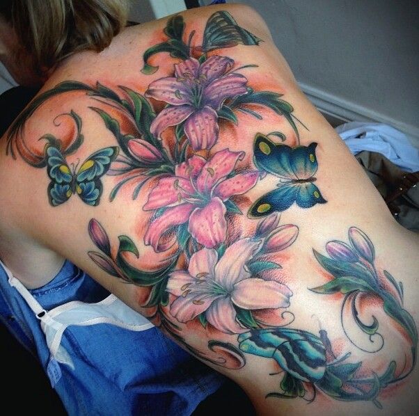 Colorful Lily Flowers With Flying Butterflies Tattoo On Full Back