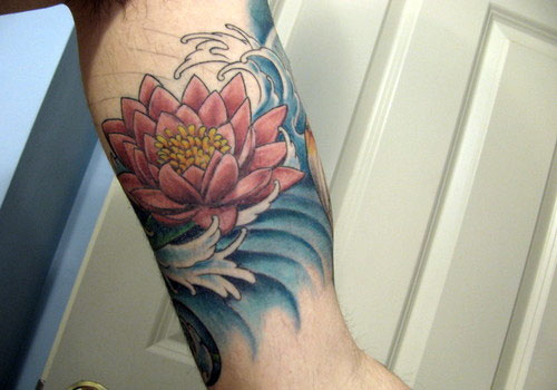 Colorful Lotus Flower In Water Tattoo On Left Bicep