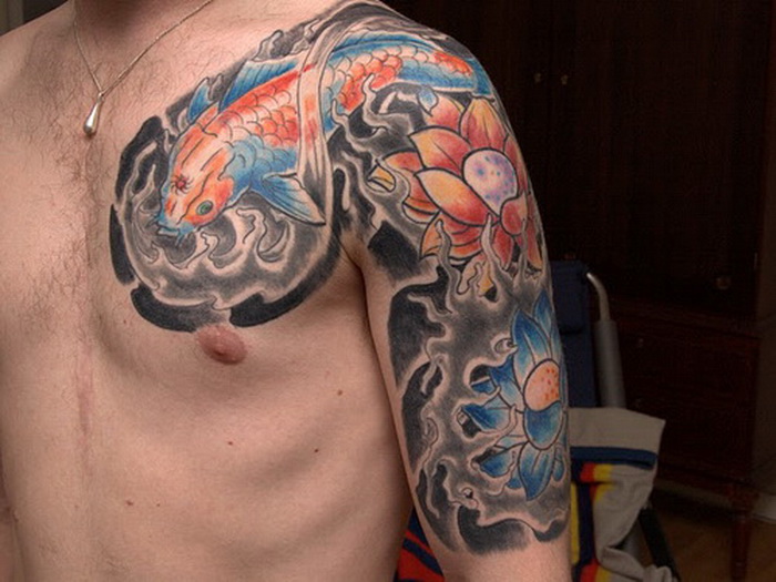 Colorful Lotus Flower With Lotus Flowers Tattoo On Man Left Upper Arm