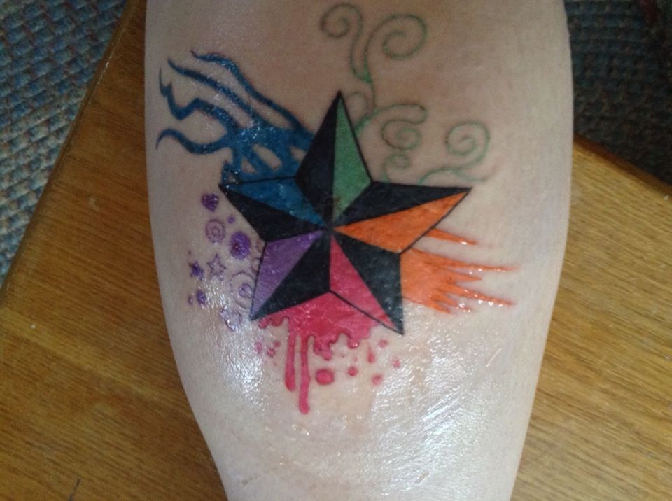 Colorful Nautical Star Tattoo On Back Leg
