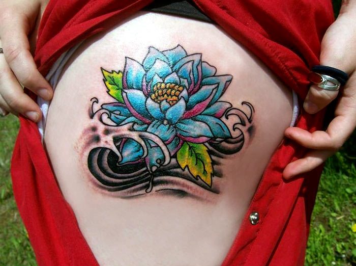 Colorful Traditional Lotus Flower Tattoo On Girl Side Thigh