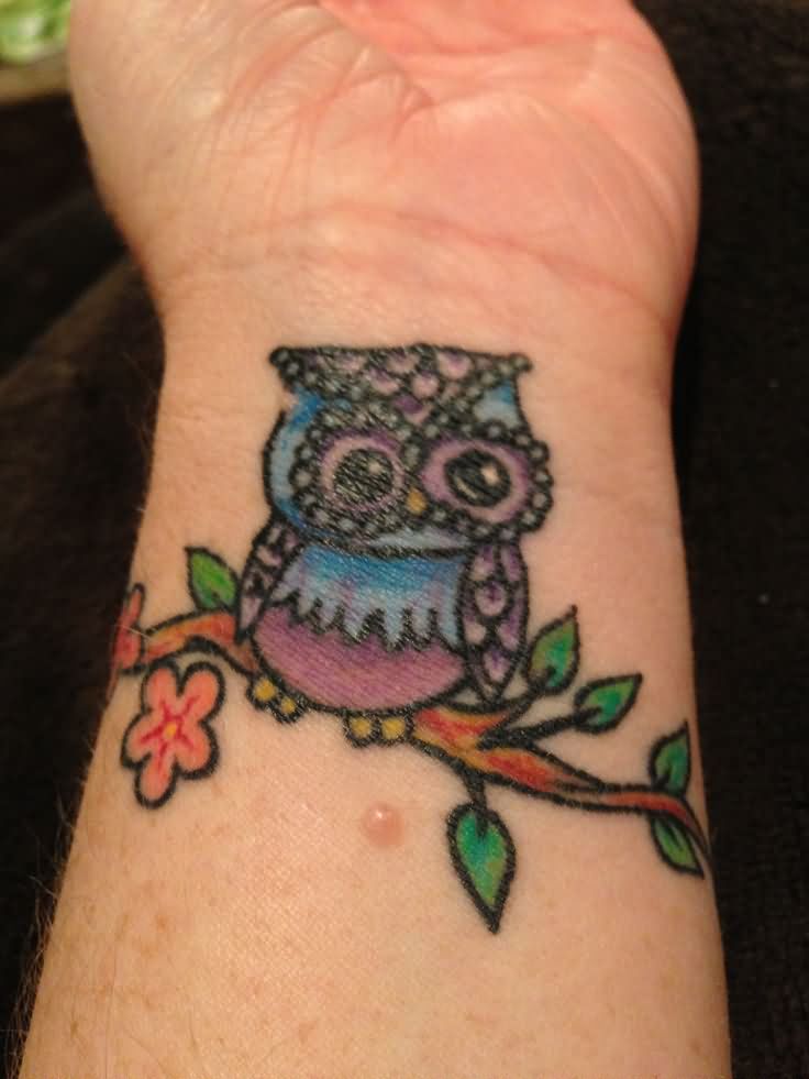 Colorful Traditional Owl On Branch Tattoo On Left Wrist
