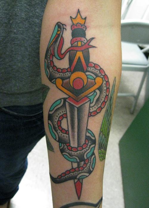 Colorful Traditional Snake With Dagger Tattoo On Forearm By Steve Boltz