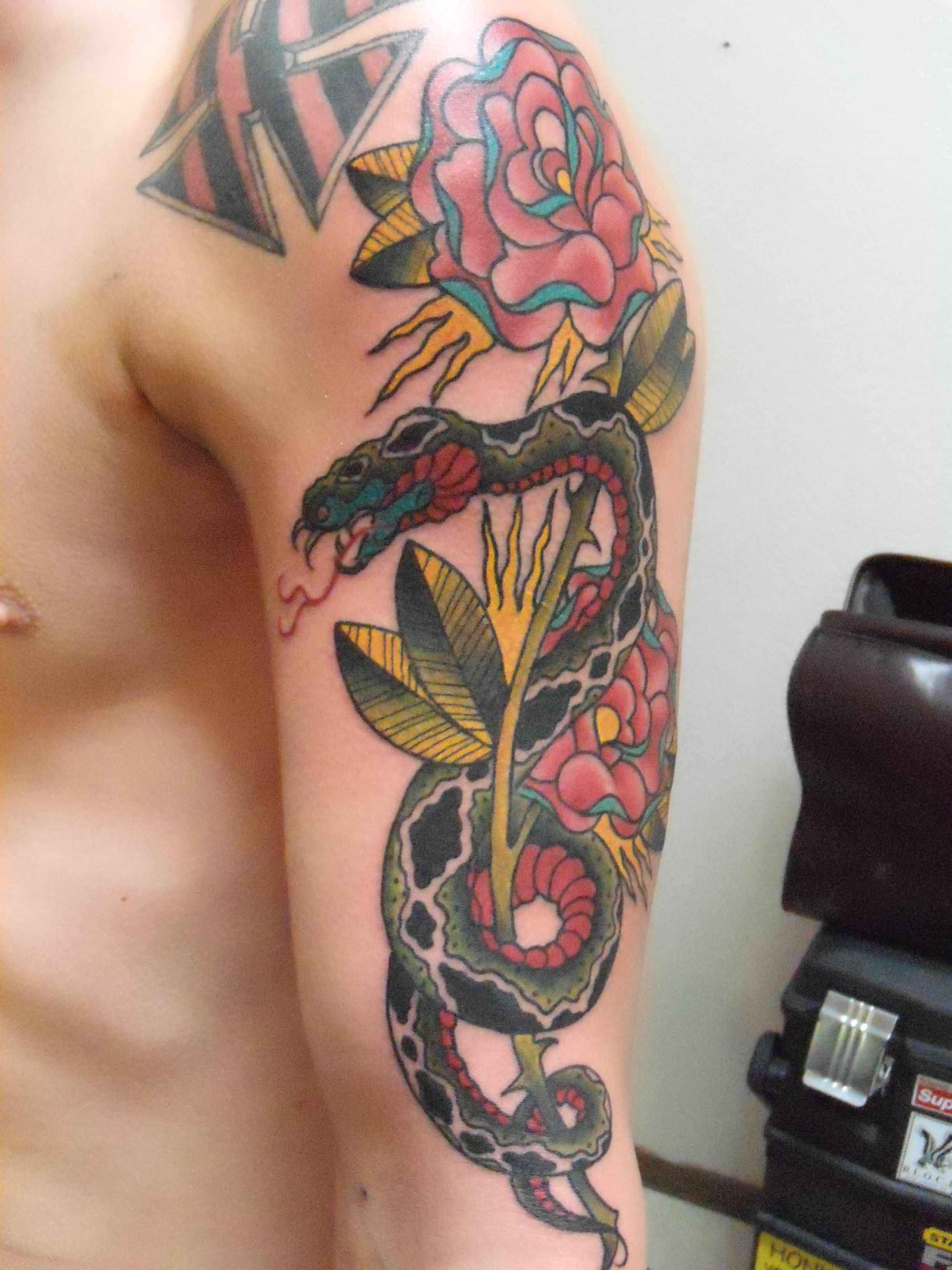 Colorful Traditional Snake With Roses Tattoo On Man Left Half Sleeve
