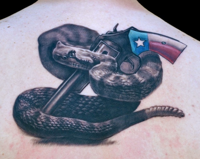 Cool 3D Rattlesnake With Gun Tattoo On Upper Back