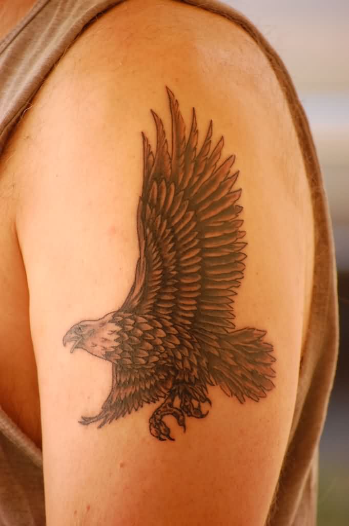 Cool Black Ink Flying Eagle Tattoo On Left Half Sleeve