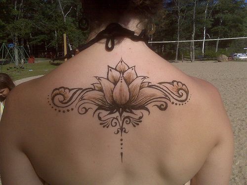 Cool Black Ink Henna Lotus Flower Tattoo On Girl Upper Back