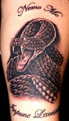 Cool Black Ink Rattlesnake Tattoo On Forearm