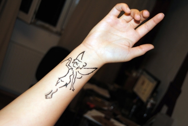 Cool Black Outline Fairy Tattoo On Right Wrist